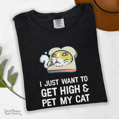 Black colored Comfort Colors 1717 cotton T-shirt, featuring a "I Just Want to Get High and pet My Cat" funny cat design illustration. One Meow Two Souls brand.