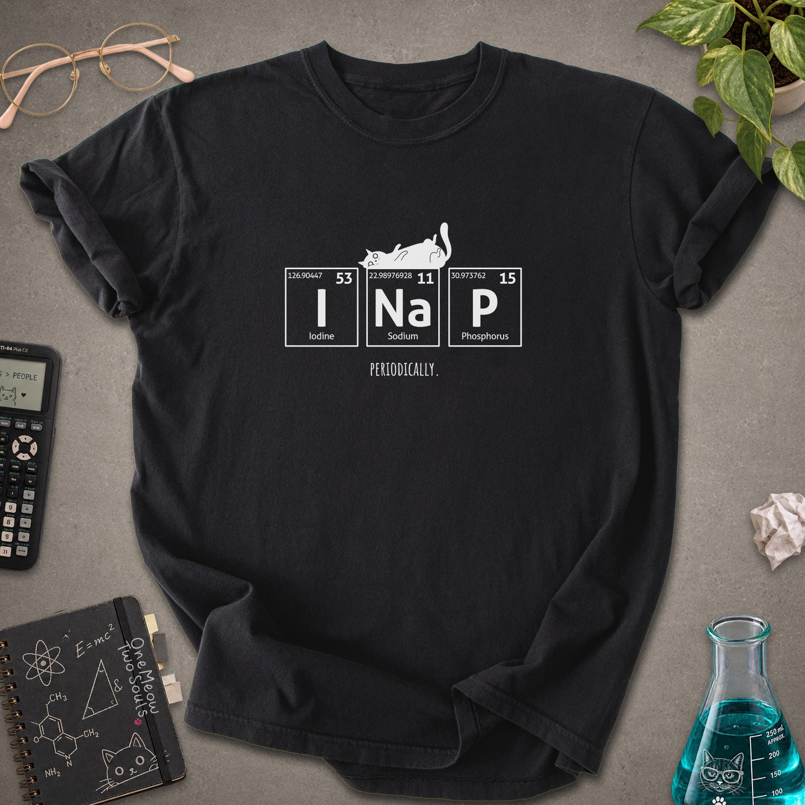 Black colored Comfort Colors 1717 cotton T-shirt, presenting a "UI Nap, Periodically." funny cat chemistry design. One Meow Two Souls brand.