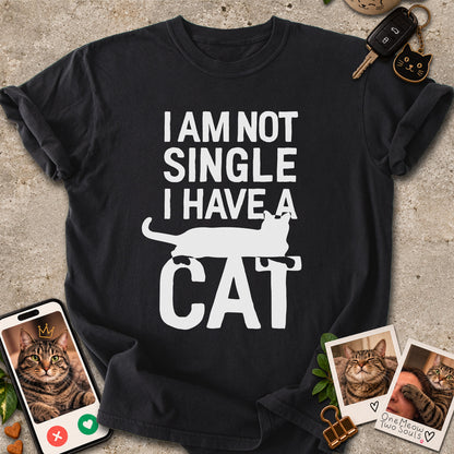 Black colored Comfort Colors 1717 cotton T-shirt, featuring a "I Am Not Single. I Have a Cat" funny cat design illustration. One Meow Two Souls brand.