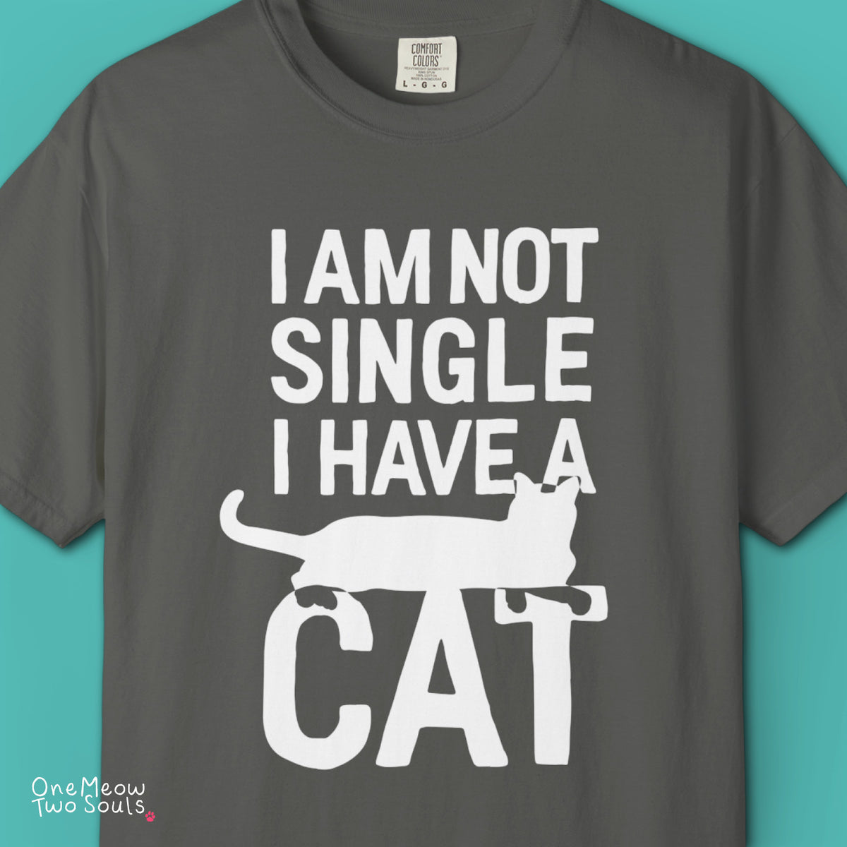 Pepper colored Comfort Colors 1717 cotton T-shirt, featuring a "I Am Not Single. I Have a Cat" funny cat design illustration. One Meow Two Souls brand.
