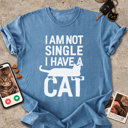 Blue Jean colored Comfort Colors 1717 cotton T-shirt, featuring a "I Am Not Single. I Have a Cat" funny cat design illustration. One Meow Two Souls brand.