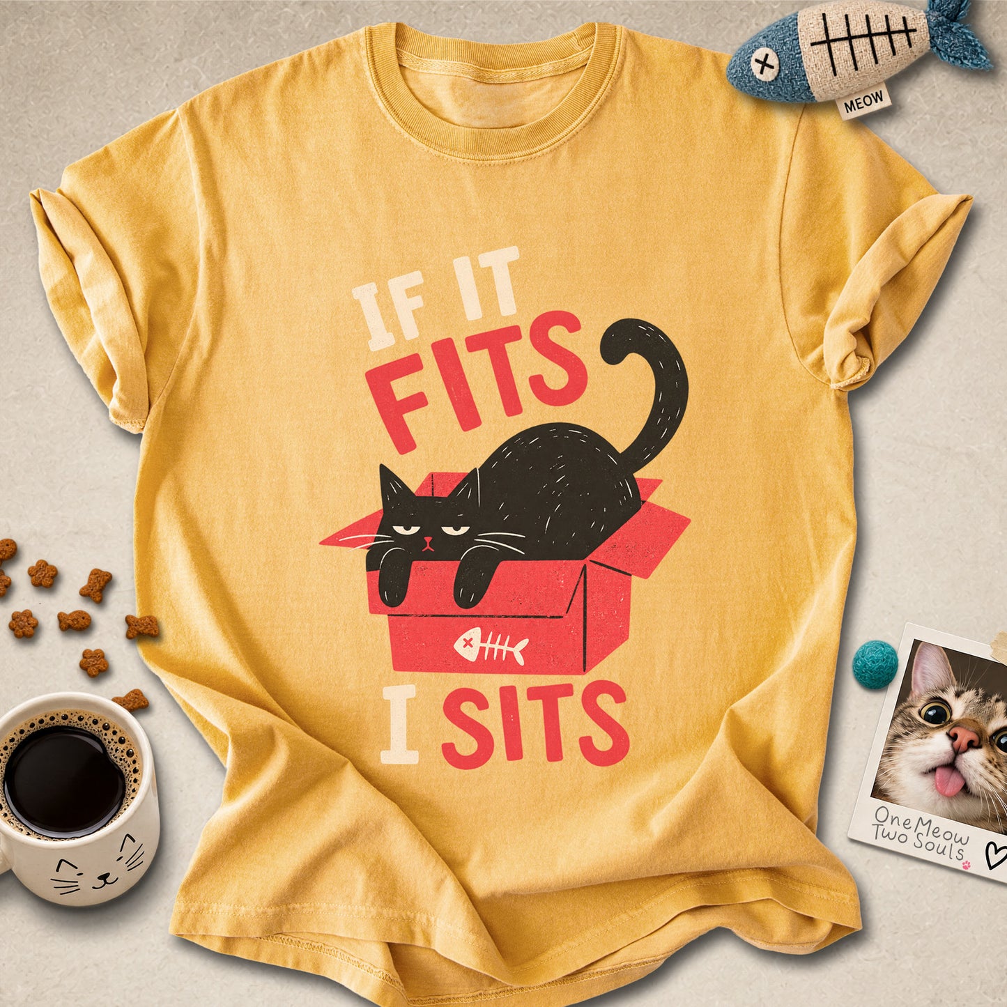 Mustard colored Comfort Colors 1717 cotton T-shirt, featuring a "If it fitsts I sits" funny cat design illustration. One Meow Two Souls brand.