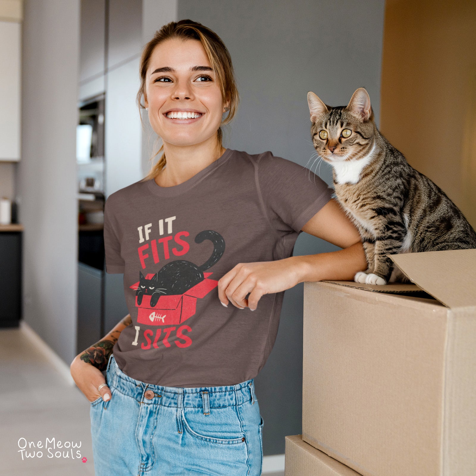 Espresso colored Comfort Colors 1717 cotton T-shirt, featuring a "If it fitsts I sits" funny cat design illustration. One Meow Two Souls brand.
