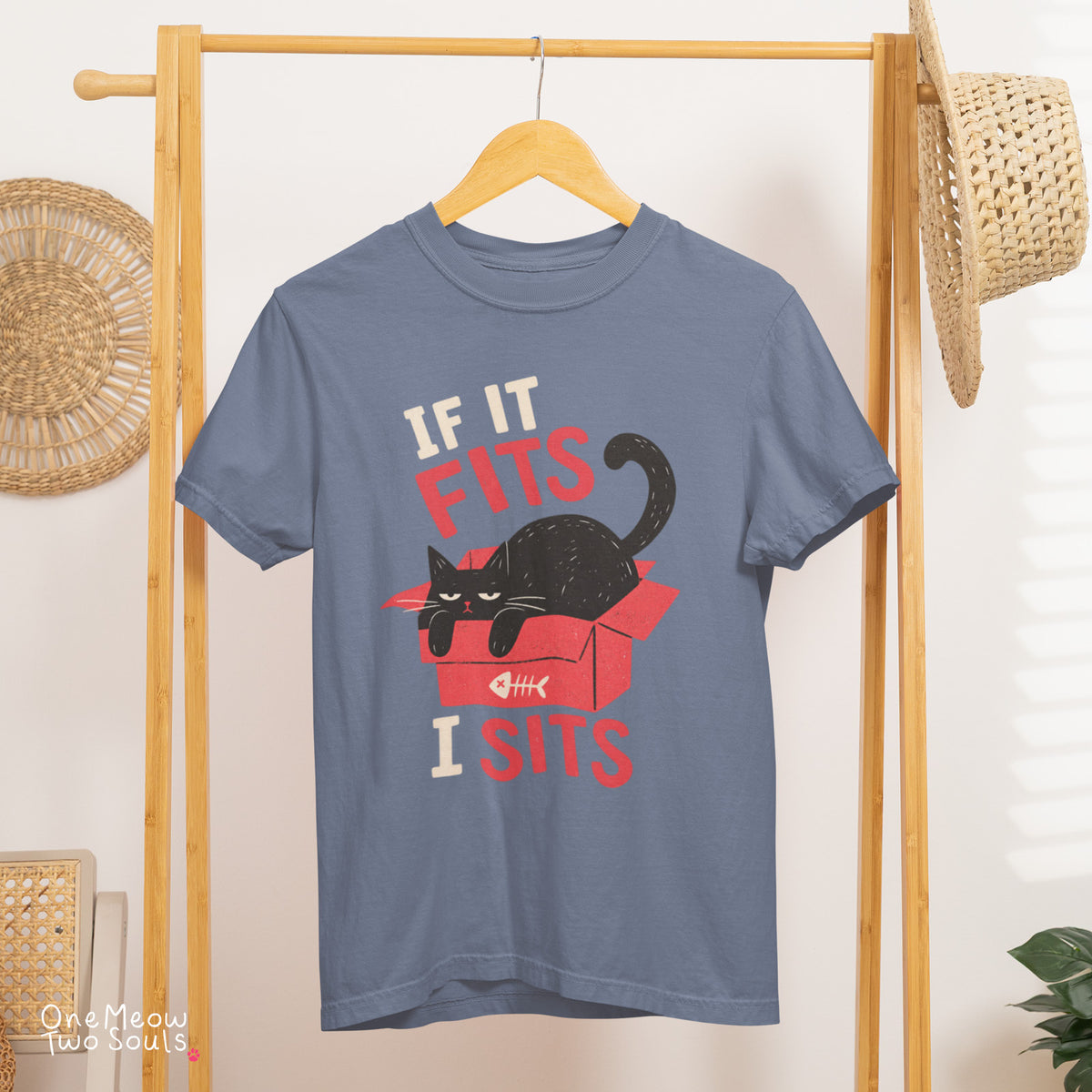 Blue jean colored Comfort Colors 1717 cotton T-shirt, featuring a "If it fitsts I sits" funny cat design illustration. One Meow Two Souls brand.
