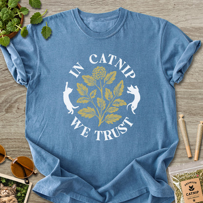 Blue Jean colored Comfort Colors 1717 cotton T-shirt, featuring a "In Catnip We Trust" funny cat design illustration. One Meow Two Souls brand.