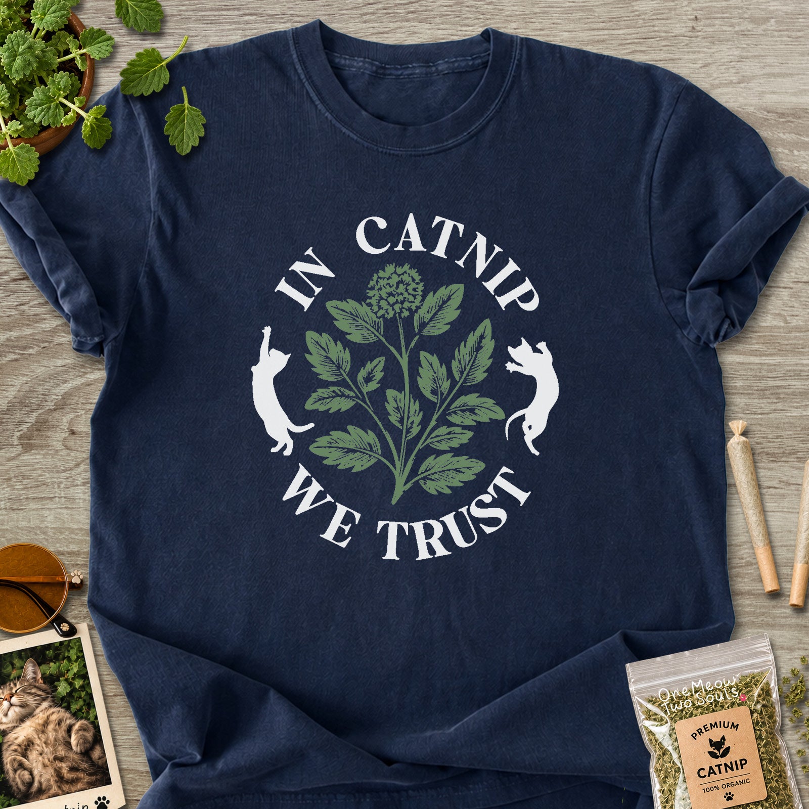 Navy colored Comfort Colors 1717 cotton T-shirt, featuring a "In Catnip We Trust" funny cat design illustration. One Meow Two Souls brand.