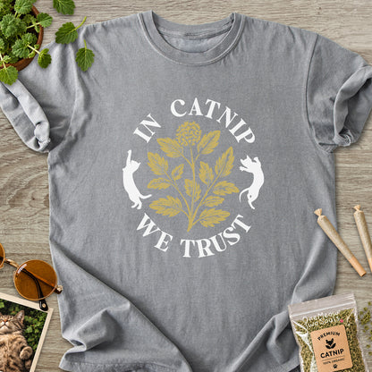 Grey colored Comfort Colors 1717 cotton T-shirt, featuring a "In Catnip We Trust" funny cat design illustration. One Meow Two Souls brand.