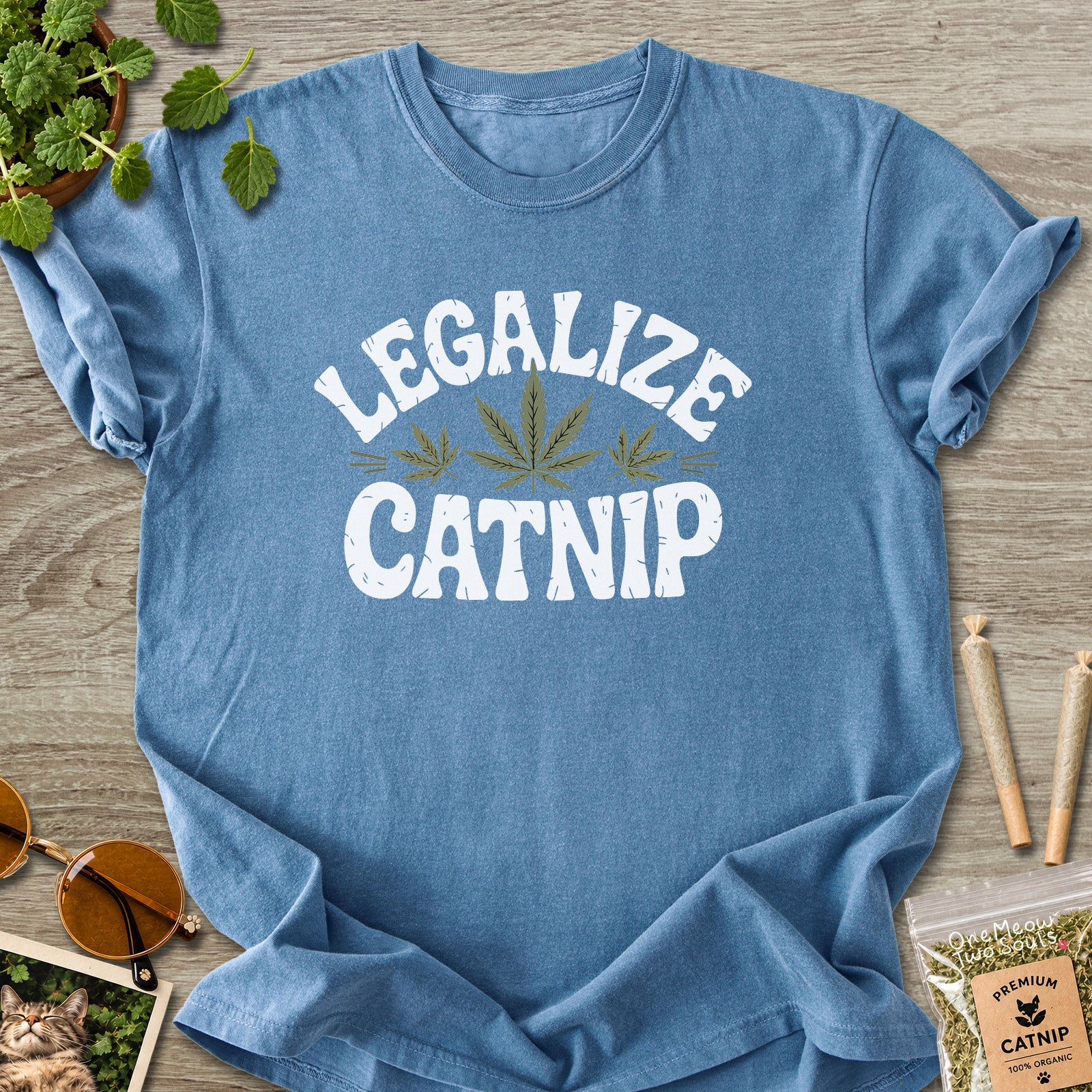 Blue jean colored Comfort Colors 1717 cotton T-shirt, featuring a "Legalize Catnip" funny cat design illustration. One Meow Two Souls brand.