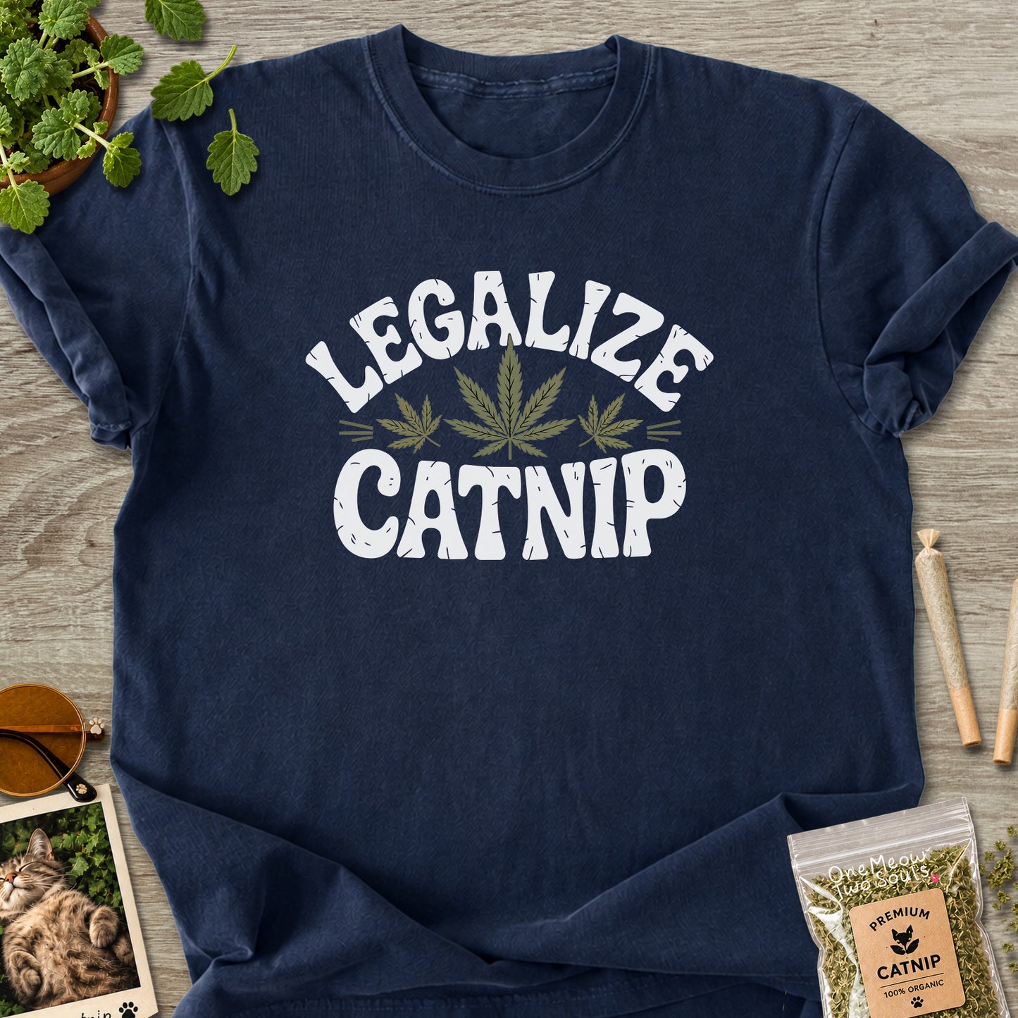 Navy colored Comfort Colors 1717 cotton T-shirt, featuring a "Legalize Catnip" funny cat design illustration. One Meow Two Souls brand.