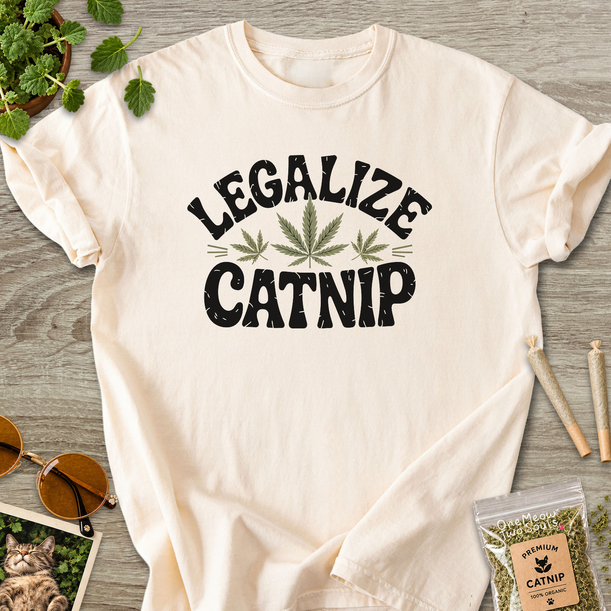 Ivory colored Comfort Colors 1717 cotton T-shirt, featuring a "Legalize Catnip" funny cat design illustration. One Meow Two Souls brand.