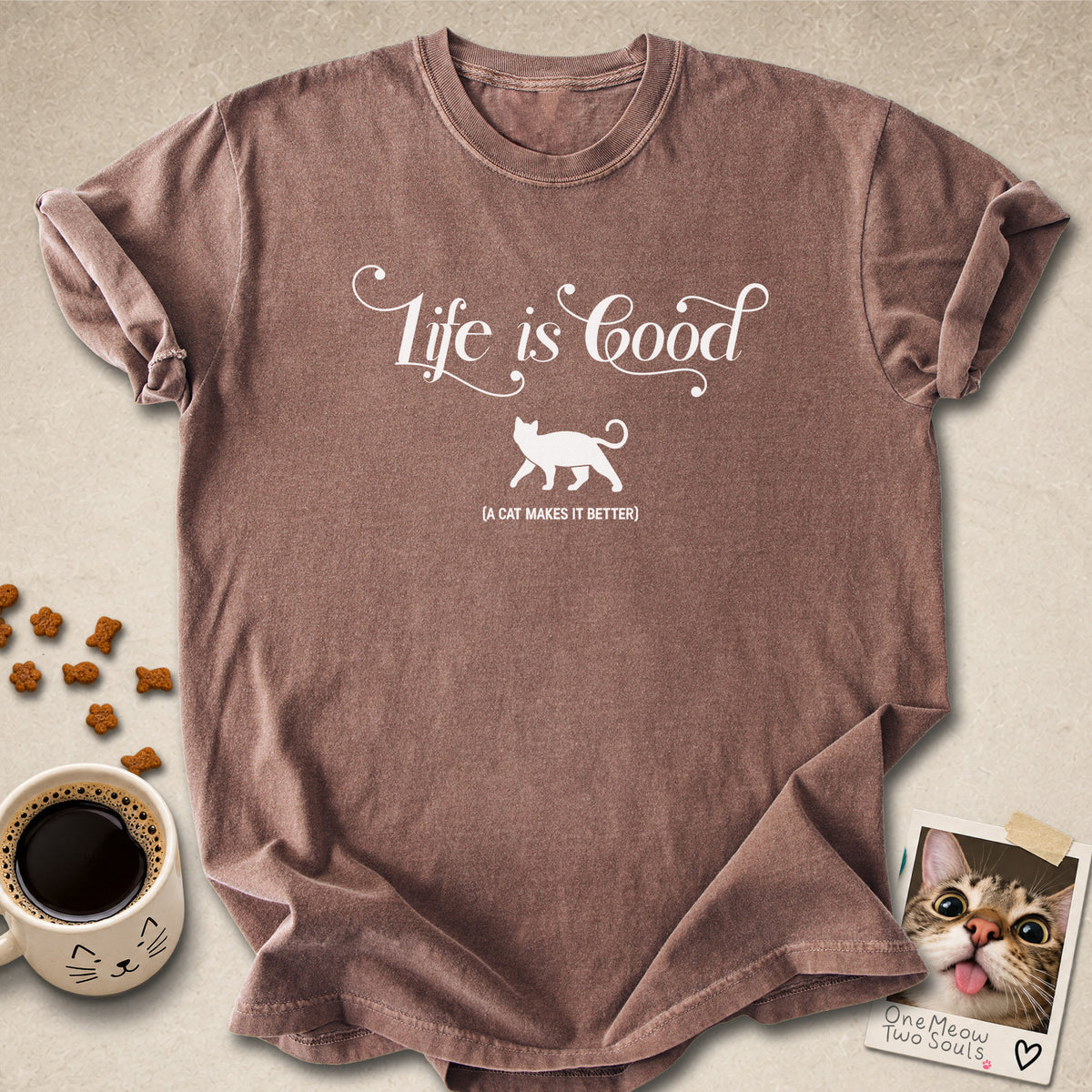 Espresso colored Comfort Colors 1717 cotton T-shirt, featuring a "Life is good. A cat makes it better" funny cat design illustration. One Meow Two Souls brand.
