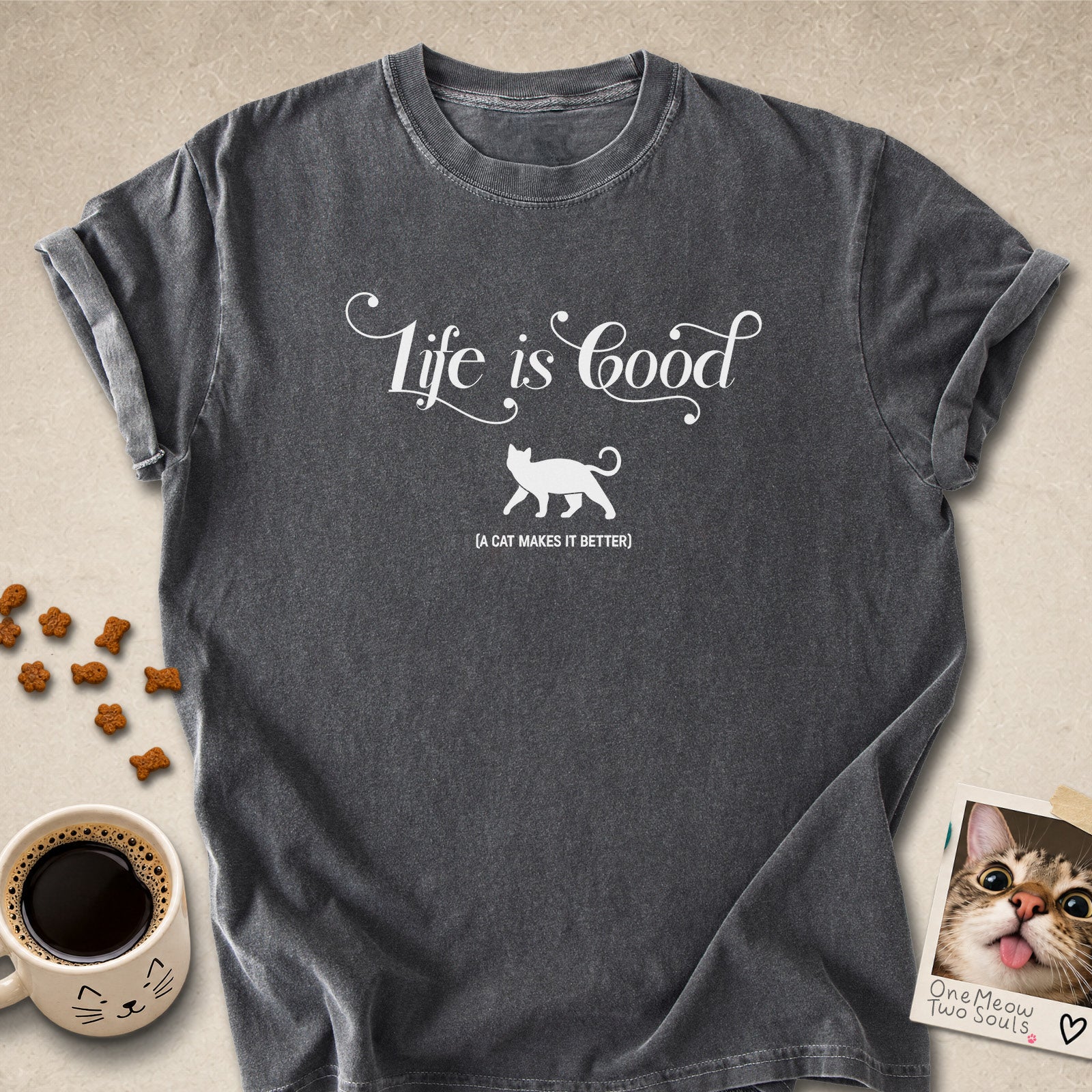 Pepper colored Comfort Colors 1717 cotton T-shirt, featuring a "Life is good. A cat makes it better" funny cat design illustration. One Meow Two Souls brand.