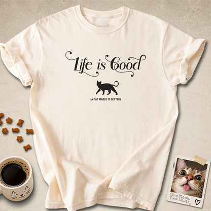 Ivory colored Comfort Colors 1717 cotton T-shirt, featuring a "Life is good. A cat makes it better" funny cat design illustration. One Meow Two Souls brand.