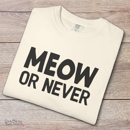 Ivory colored Comfort Colors 1717 cotton T-shirt, featuring a "Meow Or Never" funny cat design illustration. One Meow Two Souls brand.