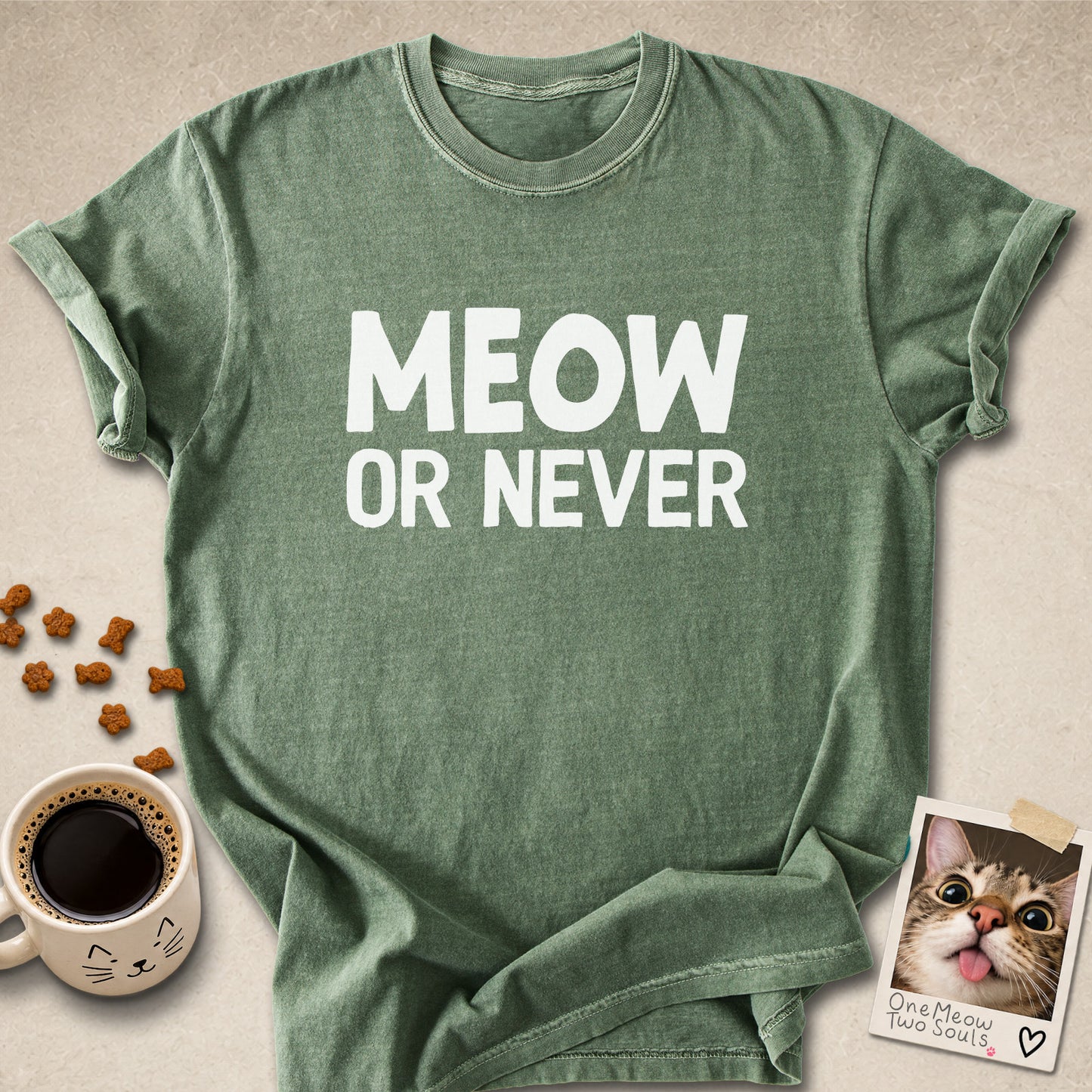 Moss colored Comfort Colors 1717 cotton T-shirt, featuring a "Meow Or Never" funny cat design illustration. One Meow Two Souls brand.