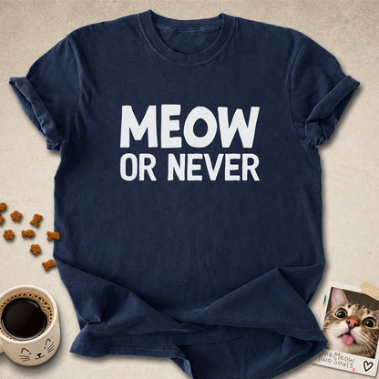 Navy colored Comfort Colors 1717 cotton T-shirt, featuring a "Meow Or Never" funny cat design illustration. One Meow Two Souls brand.