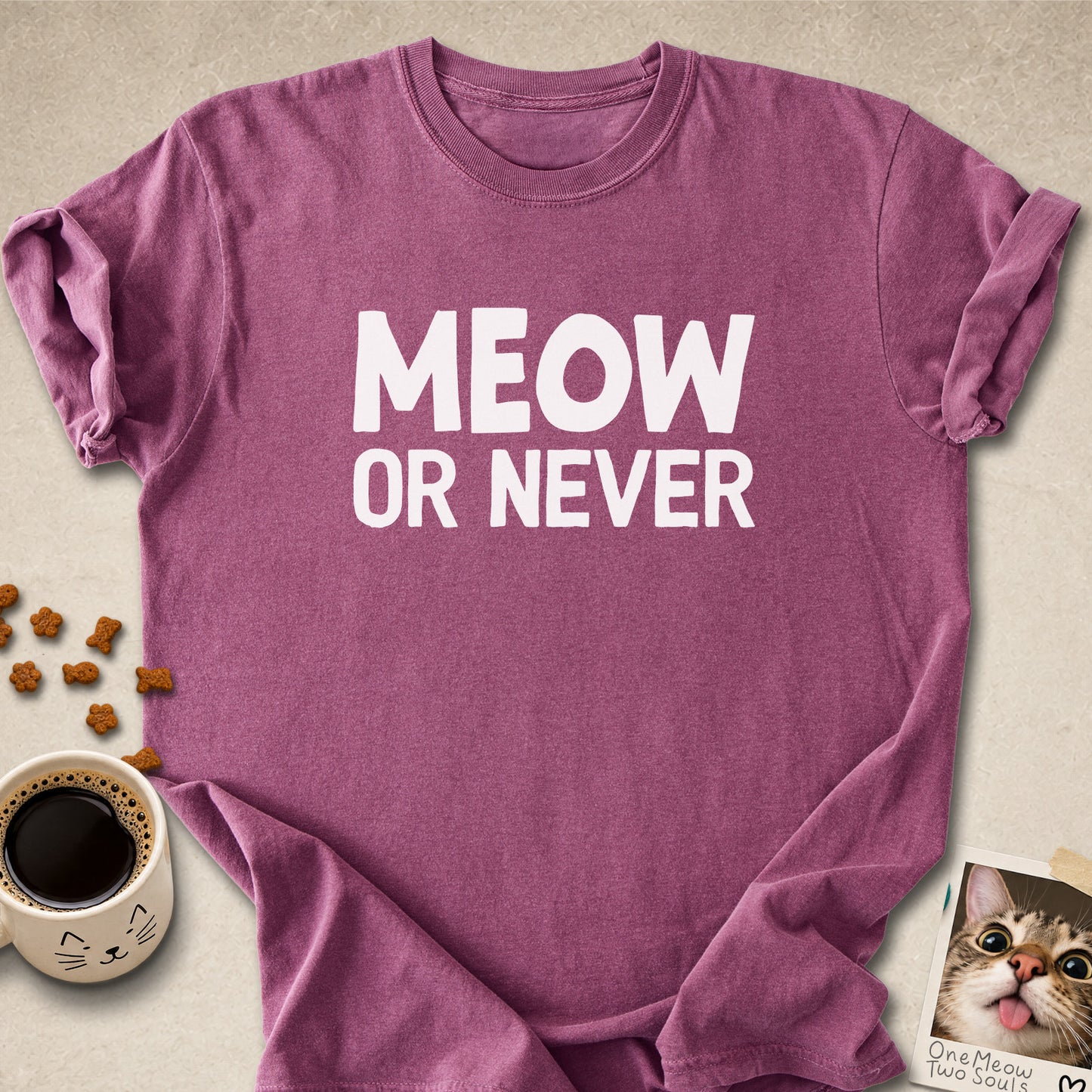 Berry colored Comfort Colors 1717 cotton T-shirt, featuring a "Meow Or Never" funny cat design illustration. One Meow Two Souls brand.