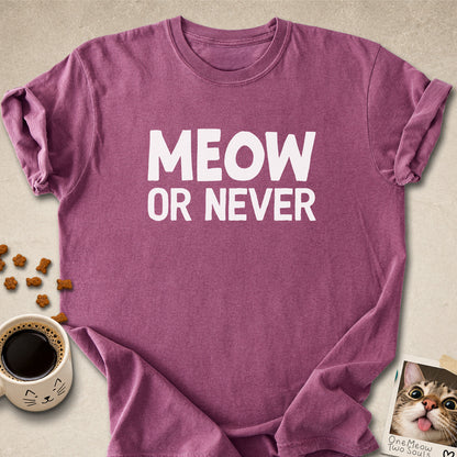Berry colored Comfort Colors 1717 cotton T-shirt, featuring a "Meow Or Never" funny cat design illustration. One Meow Two Souls brand.