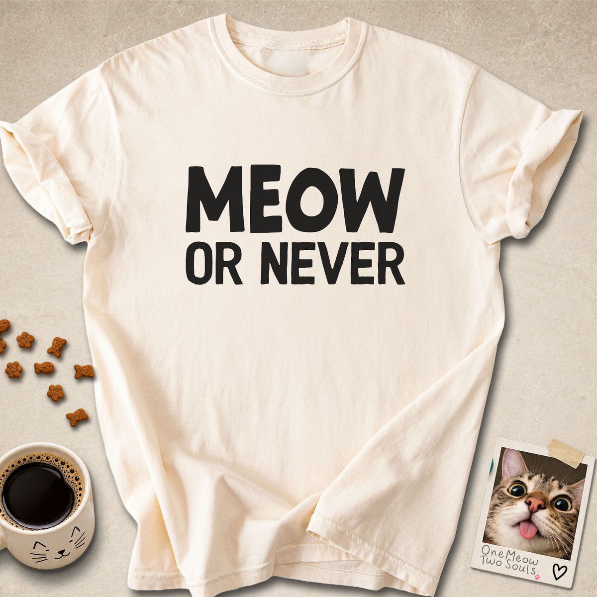 Ivory colored Comfort Colors 1717 cotton T-shirt, featuring a "Meow Or Never" funny cat design illustration. One Meow Two Souls brand.