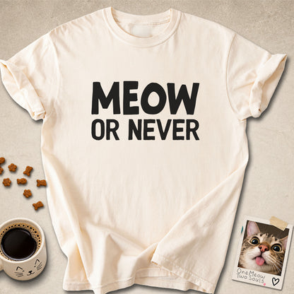 Ivory colored Comfort Colors 1717 cotton T-shirt, featuring a "Meow Or Never" funny cat design illustration. One Meow Two Souls brand.