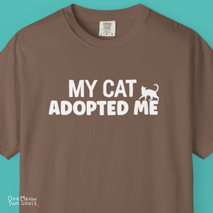 Espresso colored Comfort Colors 1717 cotton T-shirt, featuring a "My Cat Adopted Me" funny cat design illustration. One Meow Two Souls brand.