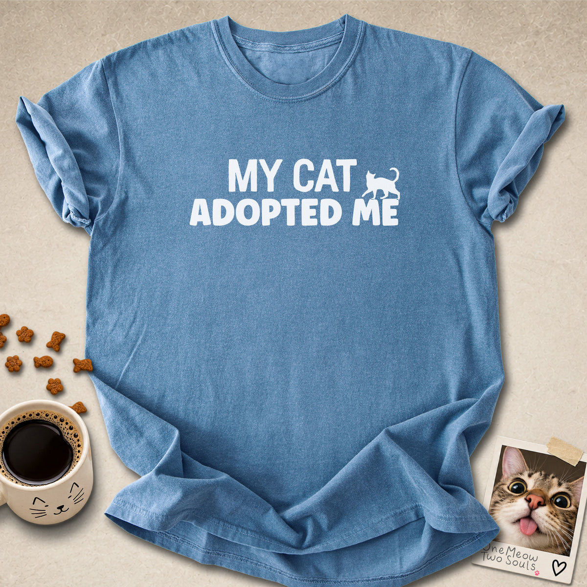 Blue Jean colored Comfort Colors 1717 cotton T-shirt, featuring a "My Cat Adopted Me" funny cat design illustration. One Meow Two Souls brand.