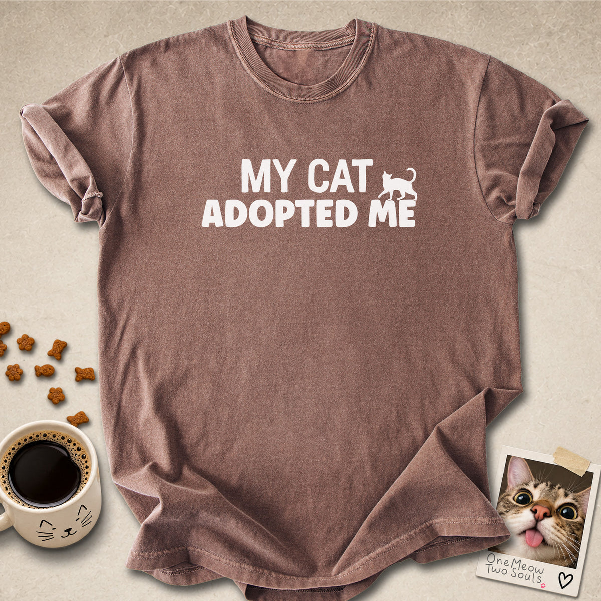 Espresso colored Comfort Colors 1717 cotton T-shirt, featuring a "My Cat Adopted Me" funny cat design illustration. One Meow Two Souls brand.