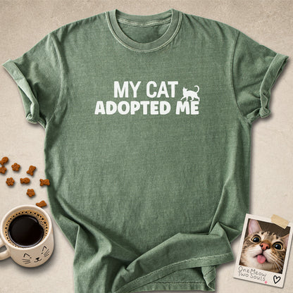 Moss colored Comfort Colors 1717 cotton T-shirt, featuring a "My Cat Adopted Me" funny cat design illustration. One Meow Two Souls brand.