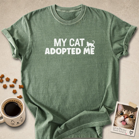 Moss colored Comfort Colors 1717 cotton T-shirt, featuring a "My Cat Adopted Me" funny cat design illustration. One Meow Two Souls brand.