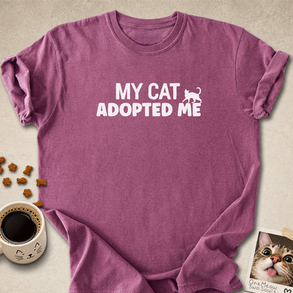 Berry colored Comfort Colors 1717 cotton T-shirt, featuring a "My Cat Adopted Me" funny cat design illustration. One Meow Two Souls brand.