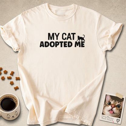 Ivory  colored Comfort Colors 1717 cotton T-shirt, featuring a "My Cat Adopted Me" funny cat design illustration. One Meow Two Souls brand.