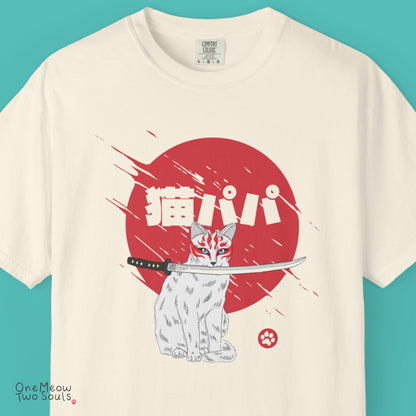 Ivory colored Comfort Colors 1717 cotton T-shirt, featuring a "Neko Papa - Cat Daddy" Japanese cat design illustration. One Meow Two Souls brand.