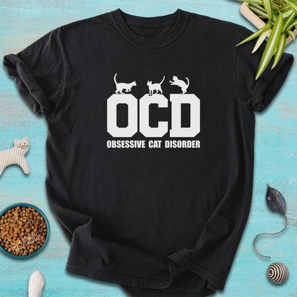 Black colored Comfort Colors 1717 t-shirt with a "OCD - Obsessive Cat Disorder" design. One Meow Two Souls brand.