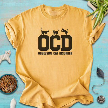 Mustard colored Comfort Colors 1717 t-shirt with a "OCD - Obsessive Cat Disorder" design. One Meow Two Souls brand.