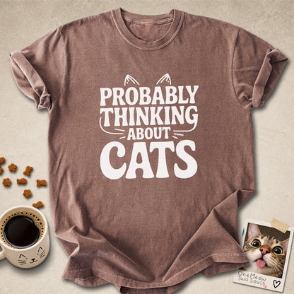Espresso colored Comfort Colors 1717 cotton T-shirt, featuring a "Probably thinking about cats" funny cat design illustration. One Meow Two Souls brand.