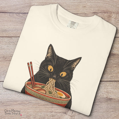 Ivory colored Comfort Colors 1717 cotton T-shirt, featuring a Black cat eating Japanese ramen noodles. Funny cat design illustration. One Meow Two Souls brand.