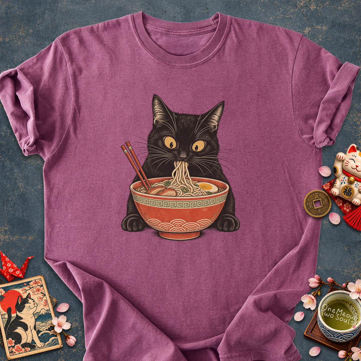 Berry colored Comfort Colors 1717 cotton T-shirt, featuring a Black cat eating Japanese ramen noodles. Funny cat design illustration. One Meow Two Souls brand.