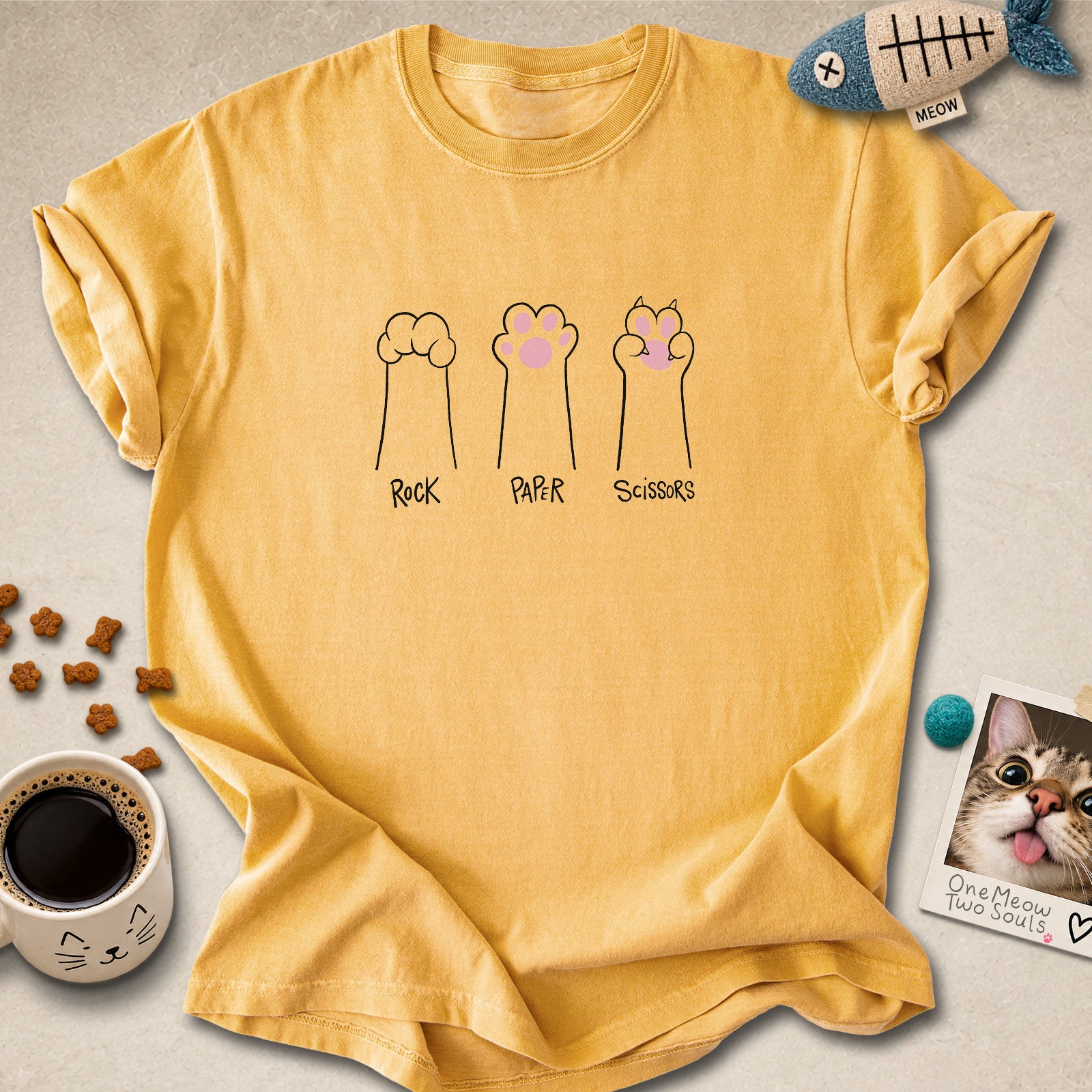 Mustard colored Comfort Colors 1717 cotton T-shirt, presenting a "Rock Paper Scissors" funny cat design. One Meow Two Souls brand.