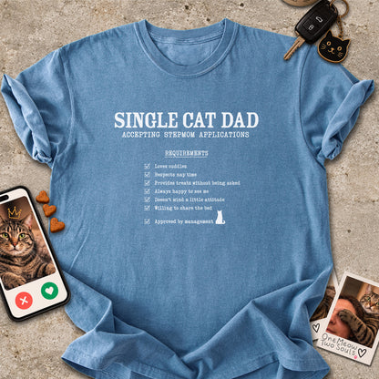 Blue Jean colored Comfort Colors 1717 cotton T-shirt, featuring a "Single cat dad accepting stepmom applications" funny cat design illustration. One Meow Two Souls brand.