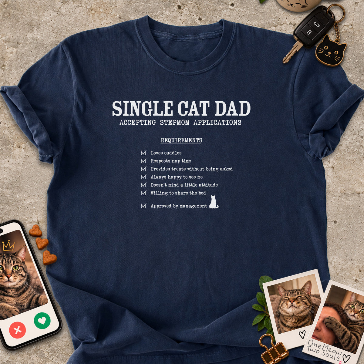 Navy colored Comfort Colors 1717 cotton T-shirt, featuring a "Single cat dad accepting stepmom applications" funny cat design illustration. One Meow Two Souls brand.
