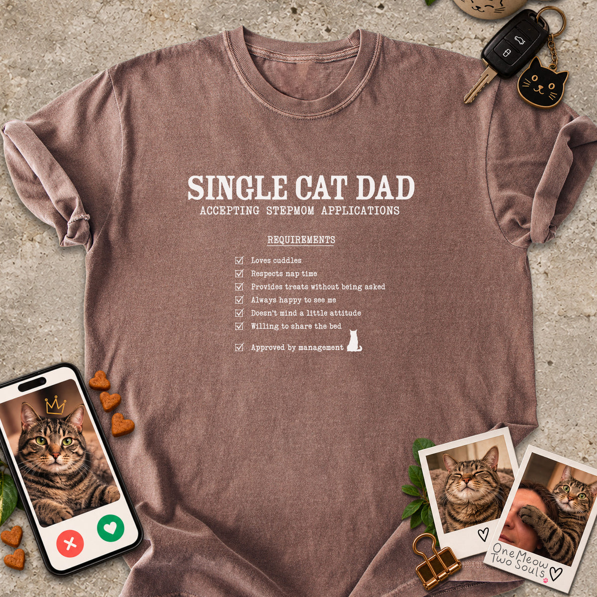 Espresso colored Comfort Colors 1717 cotton T-shirt, featuring a "Single cat dad accepting stepmom applications" funny cat design illustration. One Meow Two Souls brand.