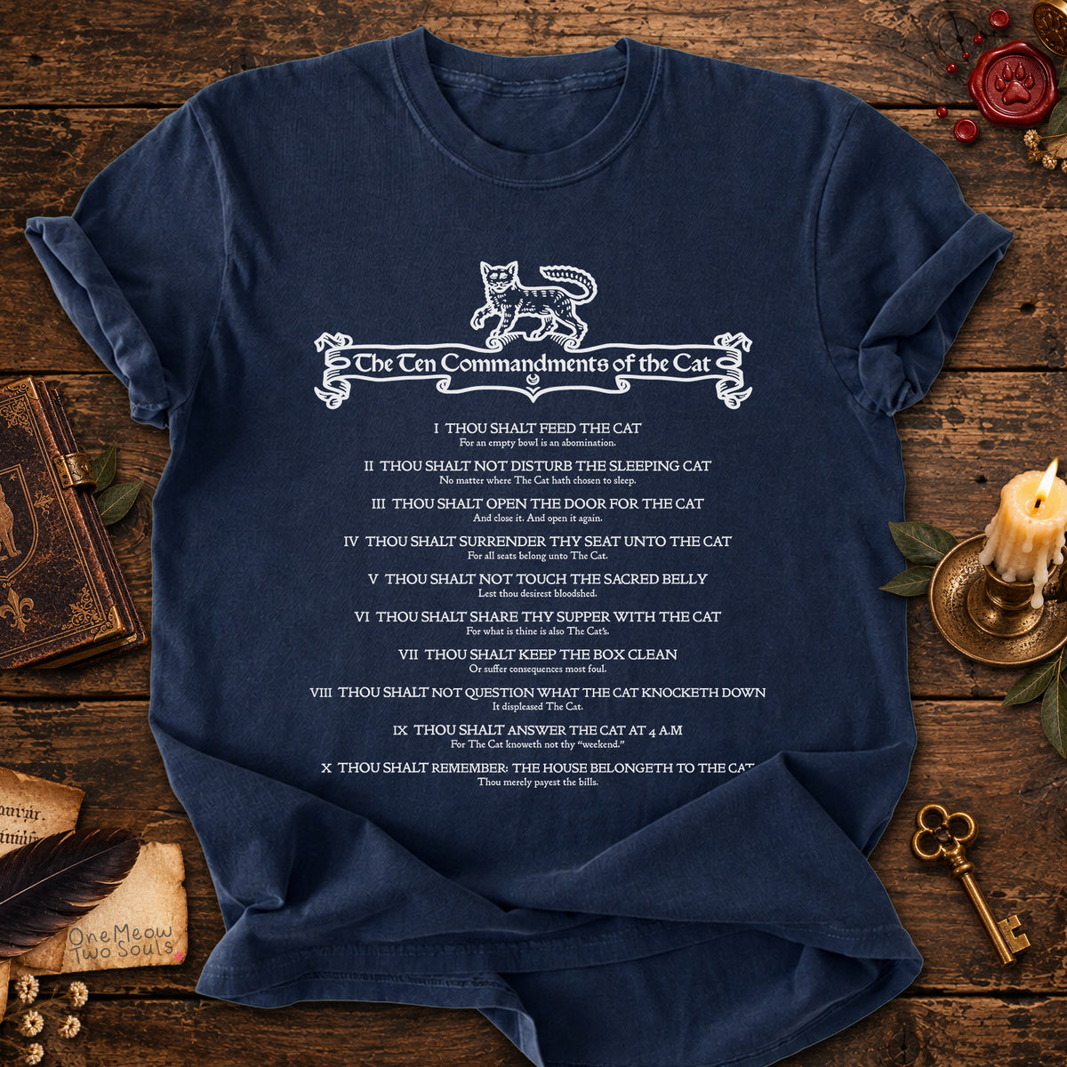 Navy colored Comfort Colors 1717 cotton T-shirt, featuring a "The Ten Commandments of the Cat" funny cat design illustration. One Meow Two Souls brand.