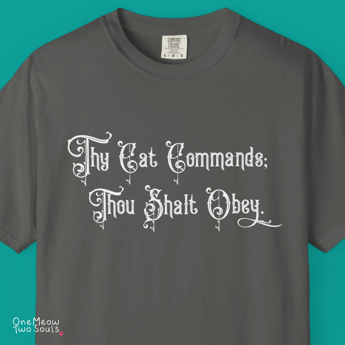 Pepper colored Comfort Colors 1717 cotton T-shirt, featuring a "Thy Cat Commands. Thou Shalt Obey" funny cat design illustration. One Meow Two Souls brand.