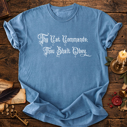 Blue Jean colored Comfort Colors 1717 cotton T-shirt, featuring a "Thy Cat Commands. Thou Shalt Obey" funny cat design illustration. One Meow Two Souls brand.