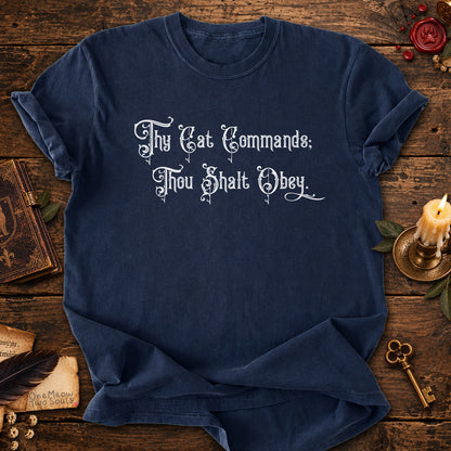 Navy colored Comfort Colors 1717 cotton T-shirt, featuring a "Thy Cat Commands. Thou Shalt Obey" funny cat design illustration. One Meow Two Souls brand.