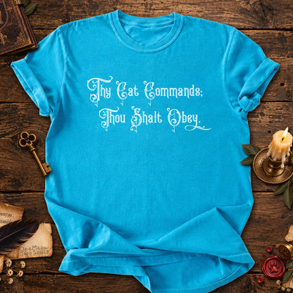 Sapphire colored Comfort Colors 1717 cotton T-shirt, featuring a "Thy Cat Commands. Thou Shalt Obey" funny cat design illustration. One Meow Two Souls brand.