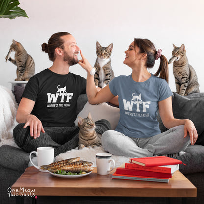 A man and a woman sitting on a couch wearing matching graphic t-shirts that read 'WTF WHERE'S THE FISH?' with a cat silhouette. Several tabby cats are sitting on the couch and table.
Comfort Colors 1717 t-shirts presenting a "WTF Where's The Fish?" funny cat design. One Meow Twou Sould brand.