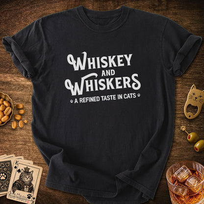 Black colored Comfort Colors 1717 cotton T-shirt, with a "Whiskey and Whiskers" design. One Meow Two Souls brand.
