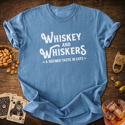 Blue Jean colored Comfort Colors 1717 cotton T-shirt, with a "Whiskey and Whiskers" design. One Meow Two Souls brand.
