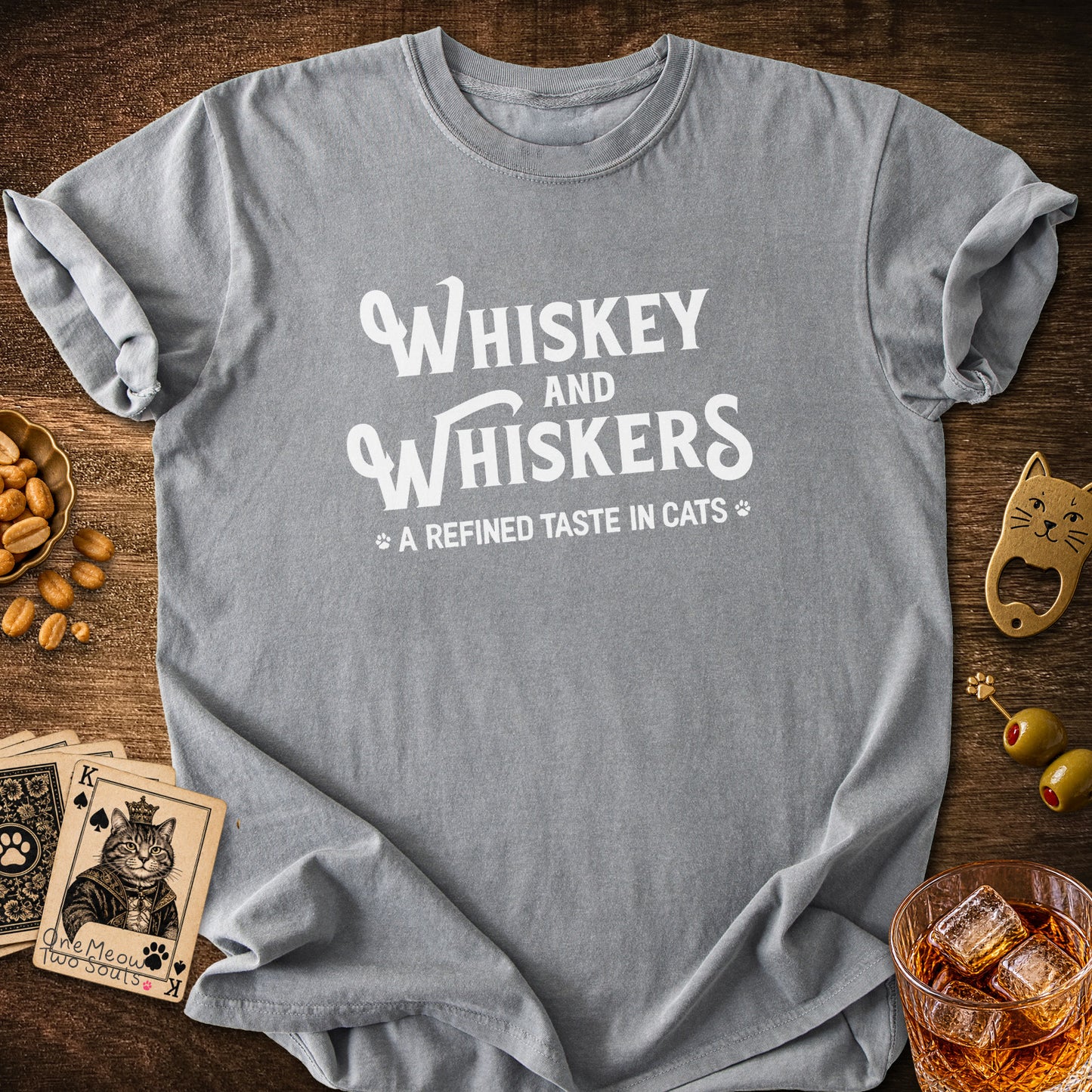 Grey colored Comfort Colors 1717 cotton T-shirt, with a "Whiskey and Whiskers" design. One Meow Two Souls brand.